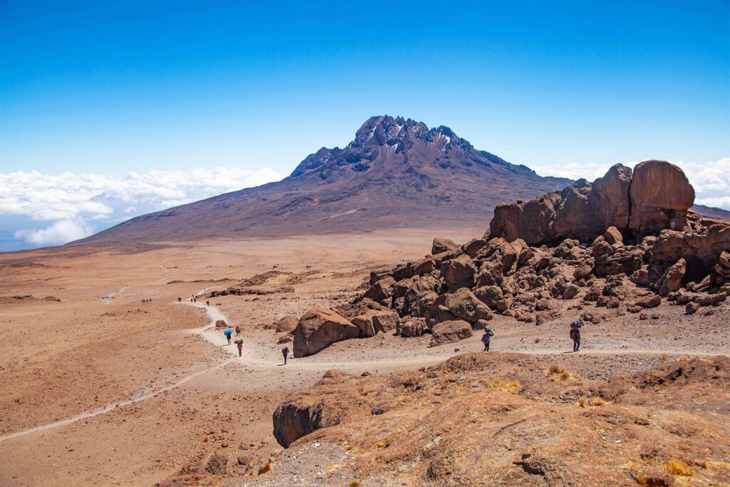 Trail leading to Mount Kilimanjaro in Tanzania with trekkers