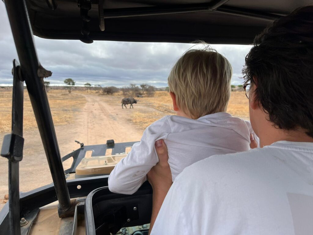 Dad and son in a safari car in Tanzania