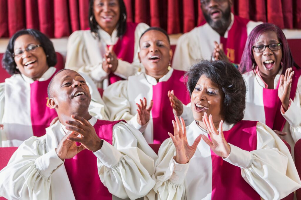 Men and women in robes singing in a gospel choir