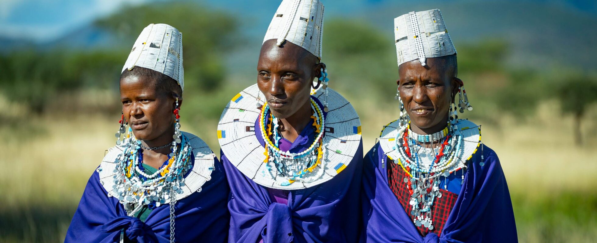 Three Maasai women in traditional clothing